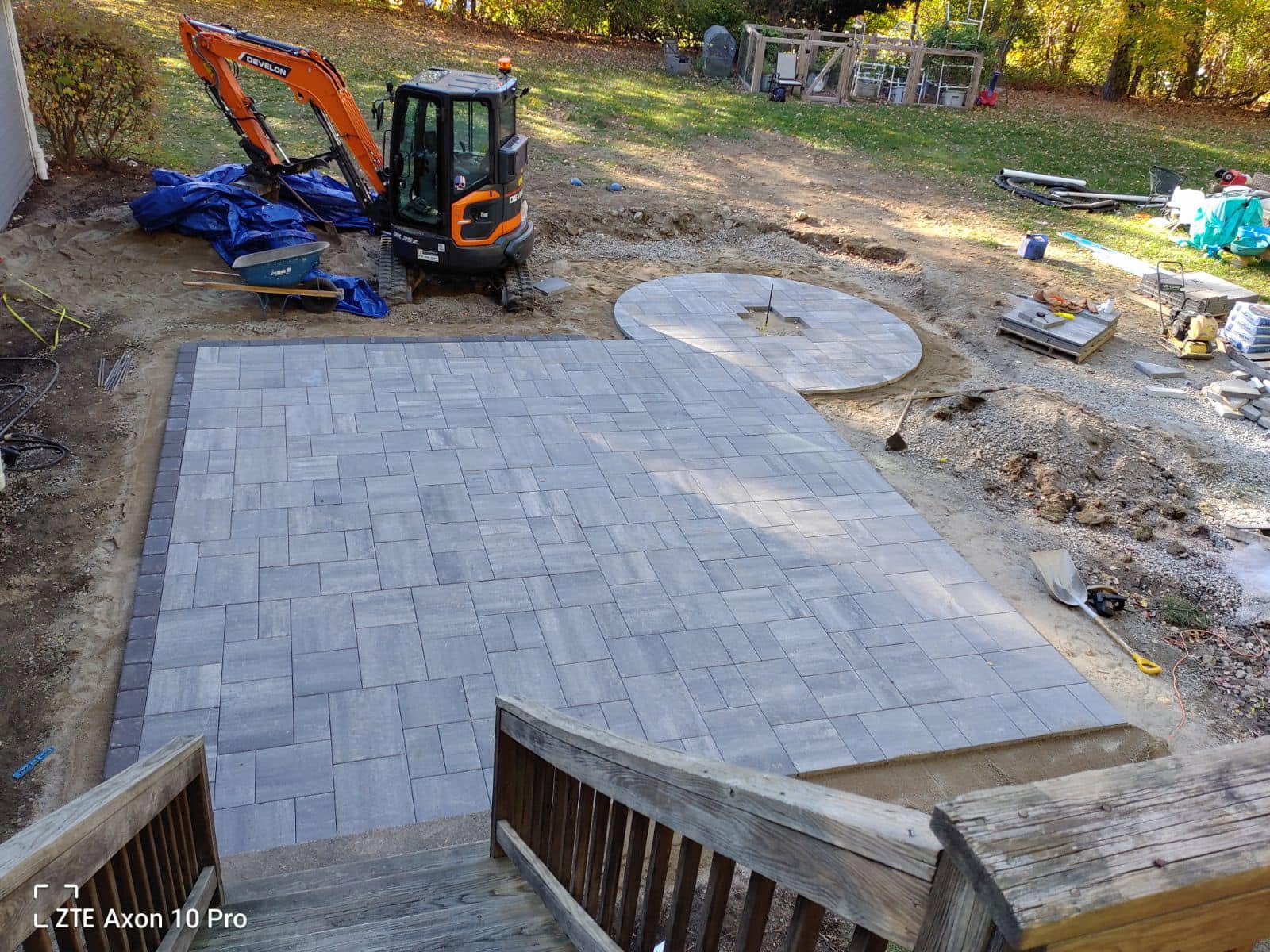 Paver patio being installed over a compacted gravel base