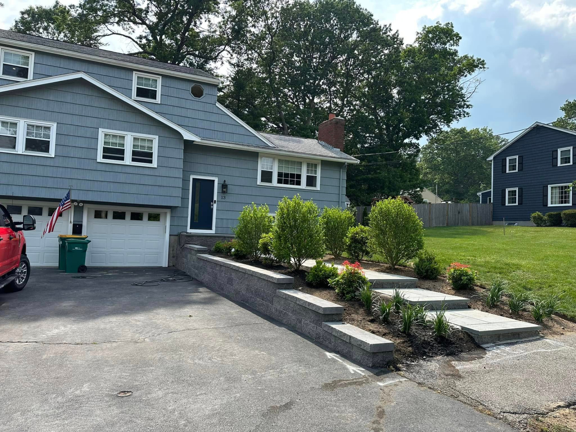 Thick striped green lawn in front of a New England colonial home